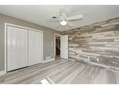 Bedroom first floor left side - Single Family Home for sale at 949 Suncrest Ln, Englewood, FL 34223 - MLS Number is D6120396