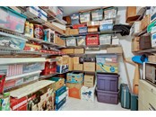 Air conditioned storage room with shelving - Single Family Home for sale at 1518 Bel Air Star Pkwy, Sarasota, FL 34240 - MLS Number is A4506654