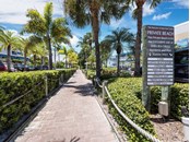 Iconic private beach access for Sandy Toes. - Condo for sale at 6810 Midnight Pass Rd, Sarasota, FL 34242 - MLS Number is A4507853