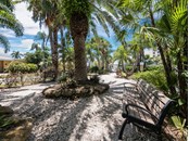 Tropical paradise setting leading to the beach. - Condo for sale at 6810 Midnight Pass Rd, Sarasota, FL 34242 - MLS Number is A4507853