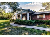 Broad front porch - Single Family Home for sale at 7700 Iguana Dr, Sarasota, FL 34241 - MLS Number is A4512842