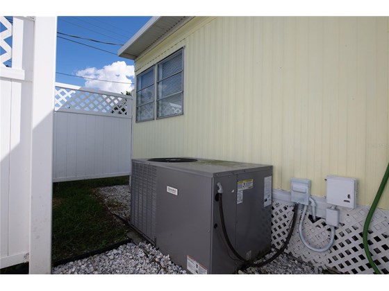 A/C outside the house - Single Family Home for sale at 104 Portia St N, Nokomis, FL 34275 - MLS Number is A4514916