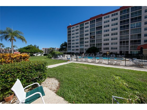View of the courtyard from your patio - Condo for sale at 244 Saint Augustine Ave #104, Venice, FL 34285 - MLS Number is A4518081