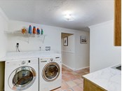 Laundry room - Single Family Home for sale at 5227 Siesta Cove Dr, Sarasota, FL 34242 - MLS Number is A4519271