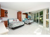 Bedroom 3; Sleeps four.  Golf course views - Condo for sale at 450 Gulf Of Mexico Dr #B107, Longboat Key, FL 34228 - MLS Number is A4520786
