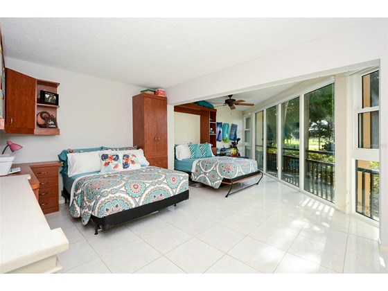 Bedroom 3; Sleeps four.  Golf course views - Condo for sale at 450 Gulf Of Mexico Dr #B107, Longboat Key, FL 34228 - MLS Number is A4520786
