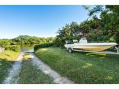 The community boat launch is just one house away, how convenient to have a private community launch - Single Family Home for sale at 1012 Bayview Dr, Nokomis, FL 34275 - MLS Number is A4521028
