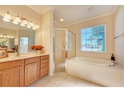 Master Bath, Garden tub, separate shower - dual vanities - Single Family Home for sale at 314 Lake Tahoe Ct, Englewood, FL 34223 - MLS Number is N6117592