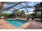 large salt water, heated pool - Single Family Home for sale at 10 Pine Ridge Way, Englewood, FL 34223 - MLS Number is N6118641